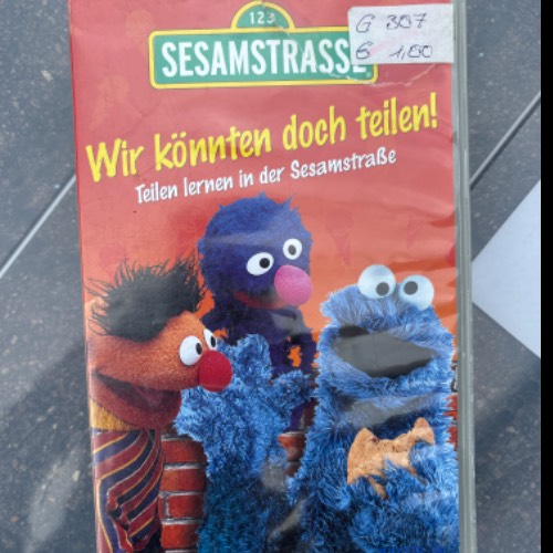 VHS Sesamstraße Teilen lernen, zu finden beim Stand 34 am Standort Flohkids Hamburg West